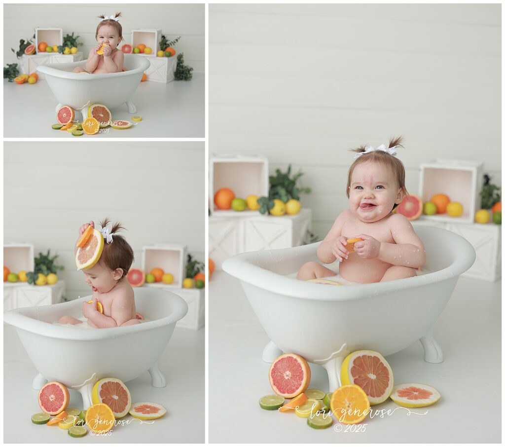 One year old girl sitting in bathtub for citrus fruit milk bath first birthday photos, making sour faces because she is eating the fruit