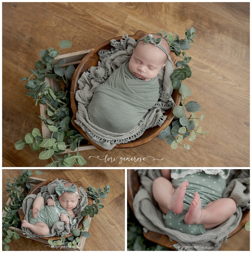 newborn girl in a sage green wrap laying in a wooden bowl accented by greenery and in a crate with a natural wood floor under her by Lehigh Valley newborn photographer Lori Generose of LG Photography