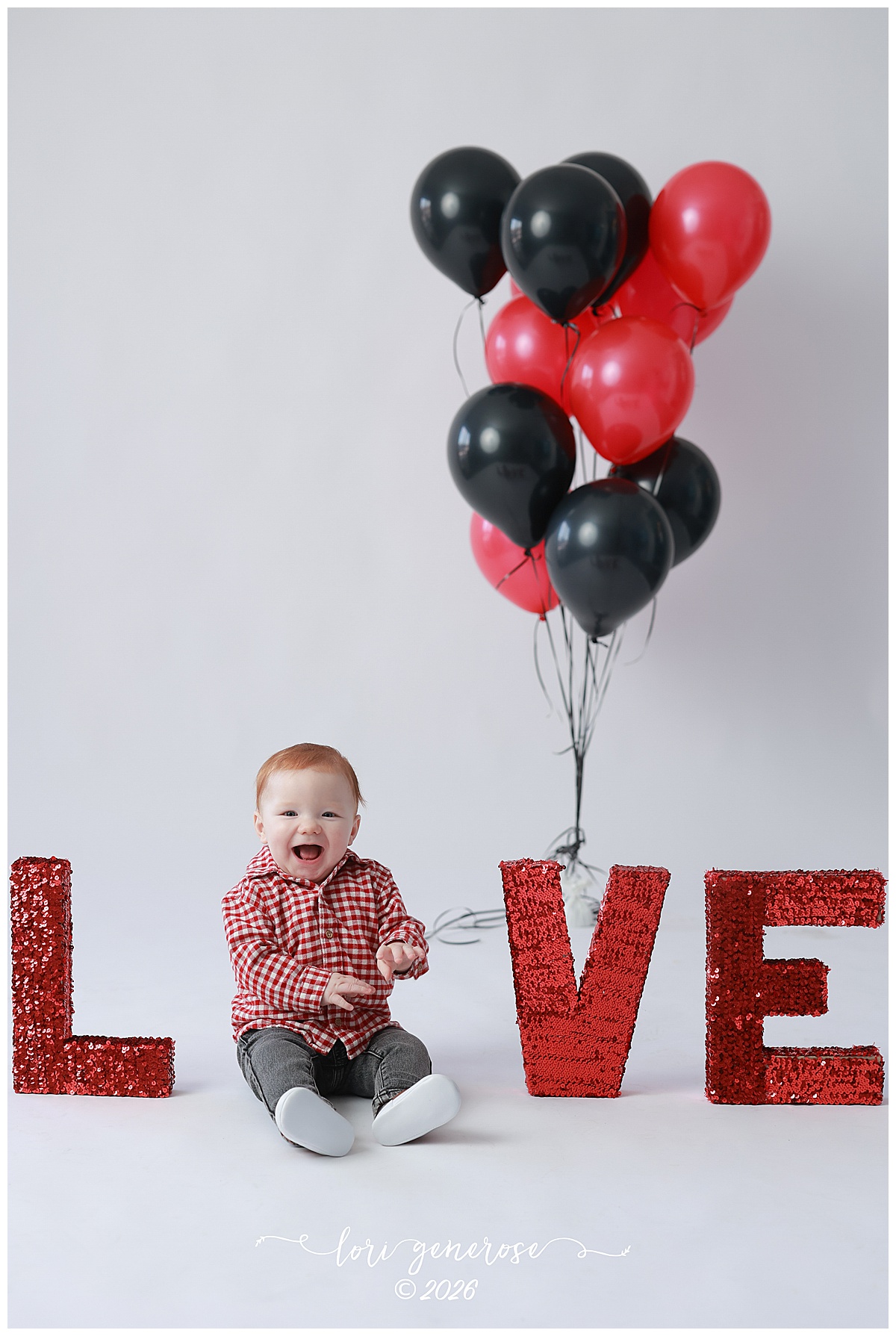 Valentine's Day photo by Lehigh Valley Photographer Lori Generose of LG Photography of an adorable baby boy sitting in the middle of the letters L-O-V-E and he is the O