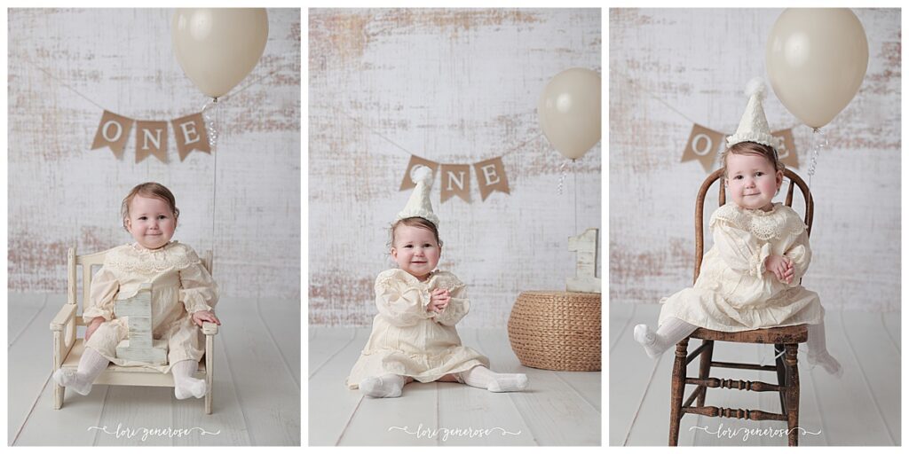 First birthday girl in a cream classic dress with a cream cone party hat for her cake smash session with Lori Generose of LG Photography, a Lehigh Valley Photographer